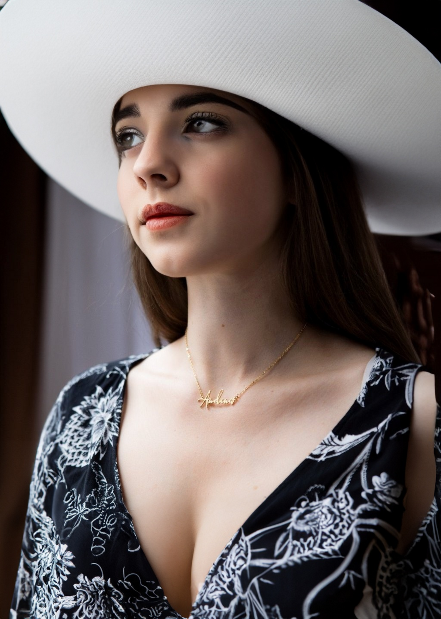 Woman wearing a personalized pendant with engraving.